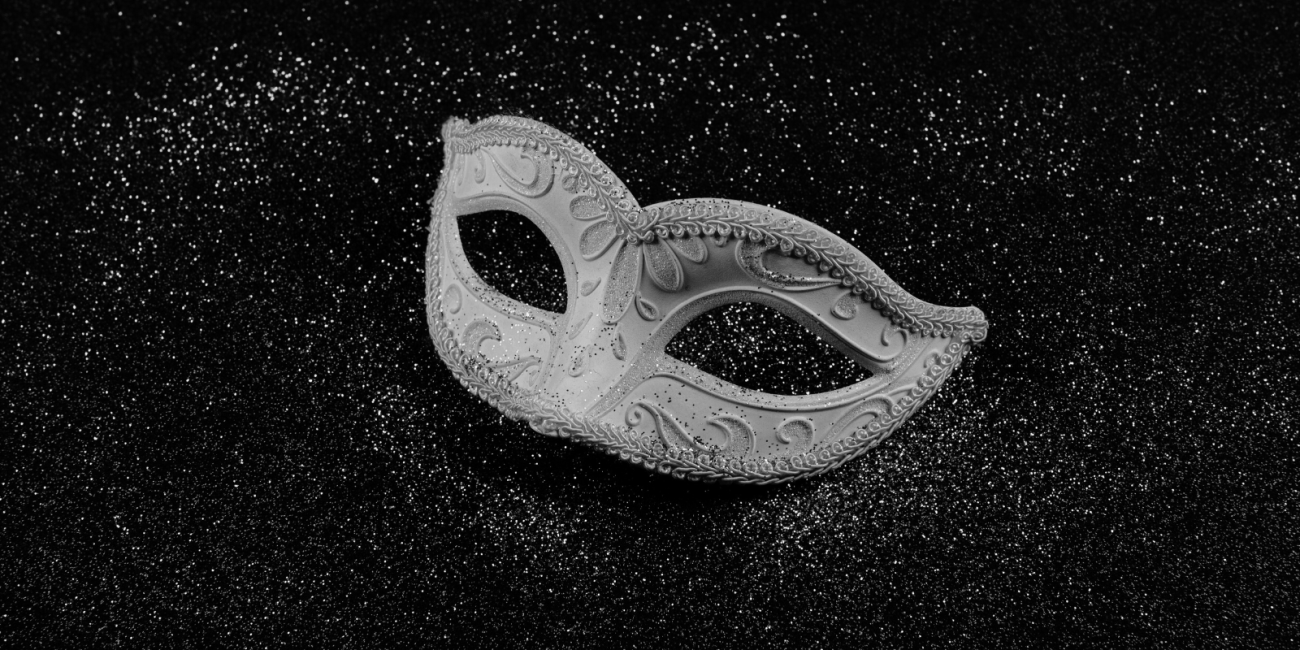 black and white image of a masquerade mask
